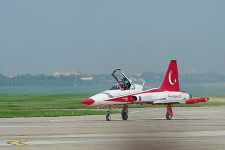 CF-116 Freedom Fighter combat plane of the Turkish Air Force during during the aviation meeting at Aurel Vlaicu Airport in Bucharest.